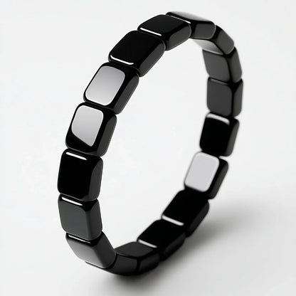 Detalle de pulsera de hematita negra masculina Hora Paris