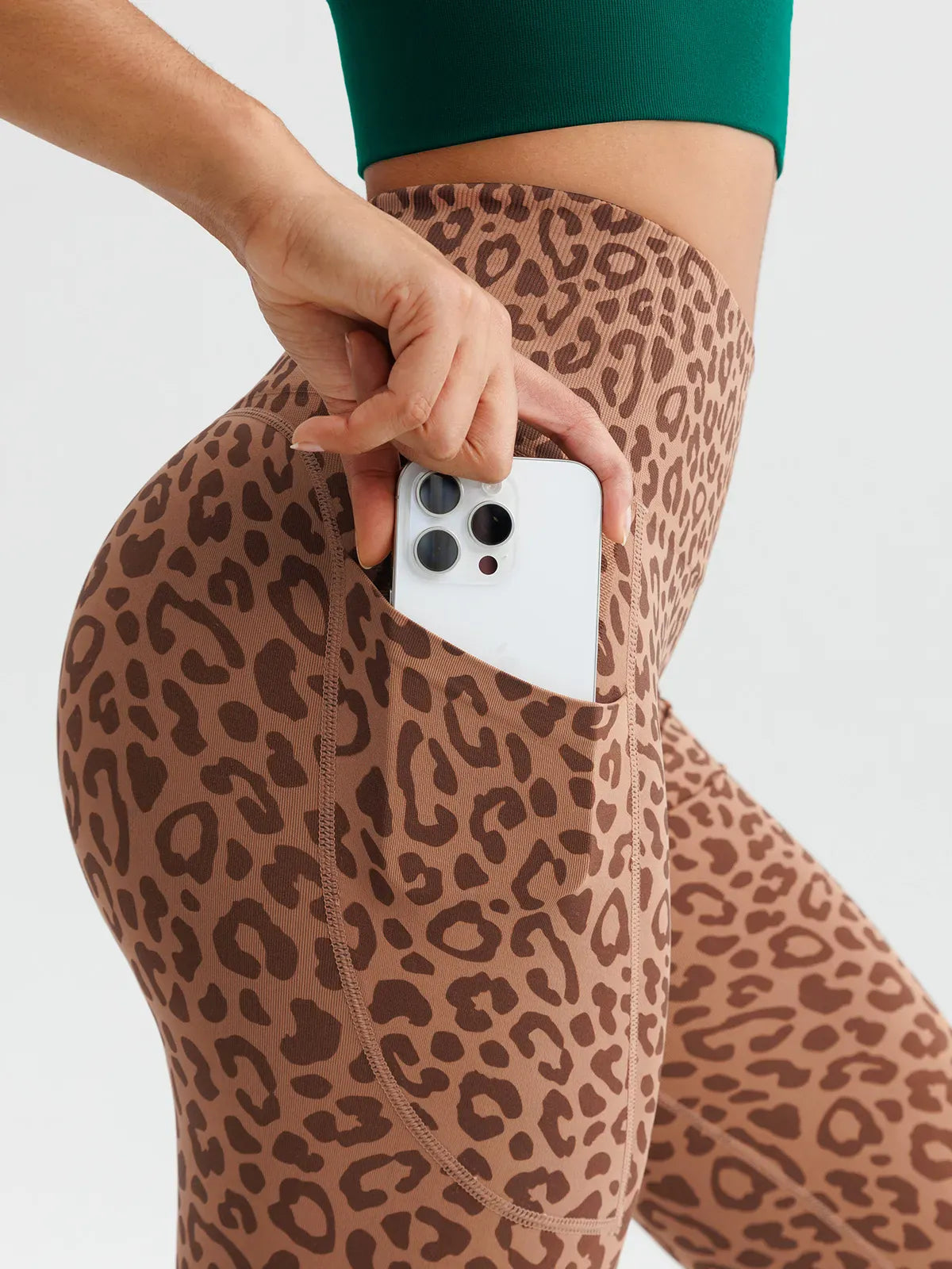 A model wearing a BRXL® B R X L™ Seamless High Waisted Butt-Lifting Leggings with Pockets