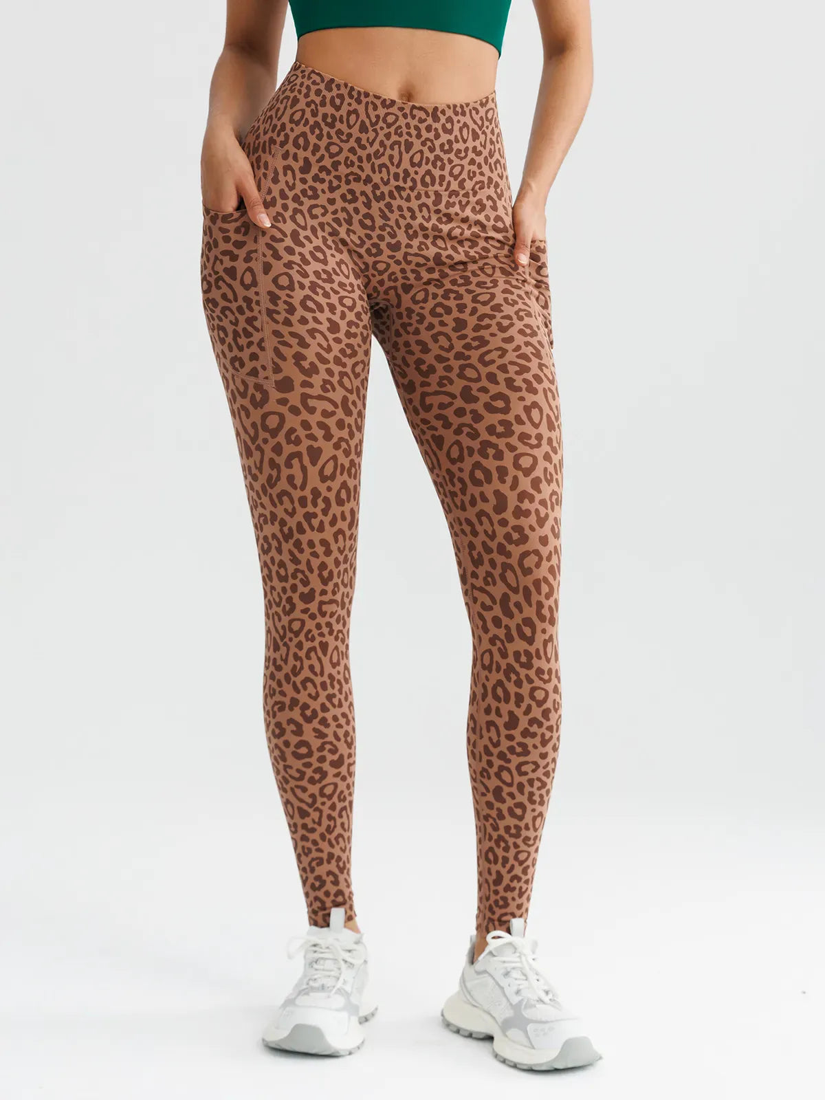 A model wearing a BRXL® B R X L™ Seamless High Waisted Butt-Lifting Leggings with Pockets