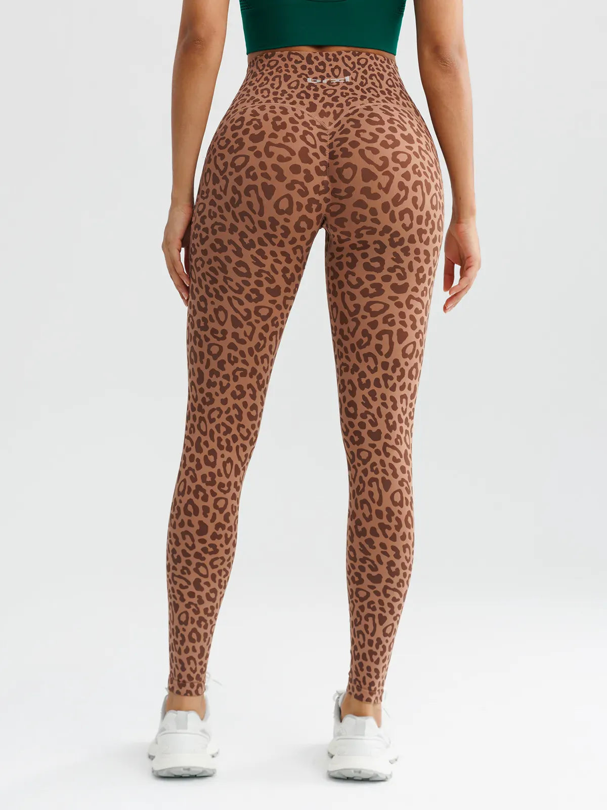 A model wearing a BRXL® B R X L™ Seamless High Waisted Butt-Lifting Leggings with Pockets