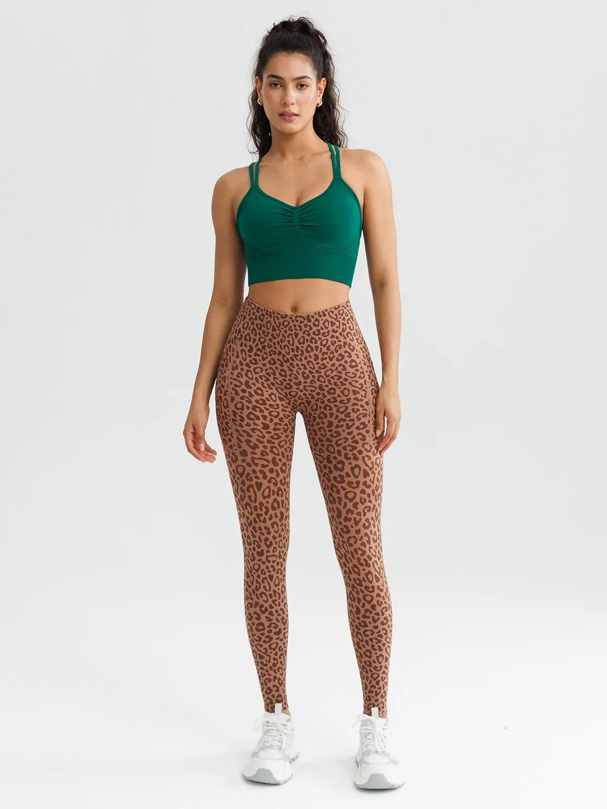 A model wearing a BRXL® B R X L™ Seamless High Waisted Butt-Lifting Leggings with Pockets