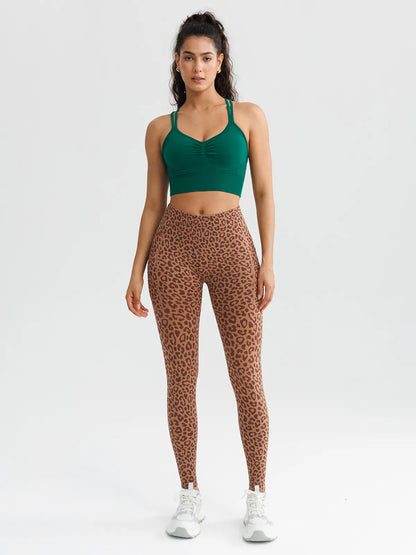 A model wearing a BRXL® B R X L™ Seamless High Waisted Butt-Lifting Leggings with Pockets