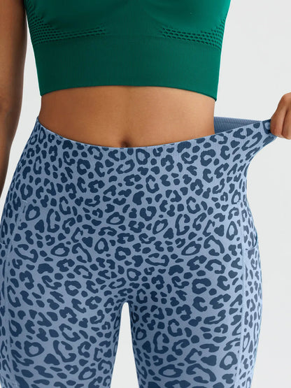 A model wearing a BRXL® B R X L™ Seamless High Waisted Butt-Lifting Leggings with Pockets