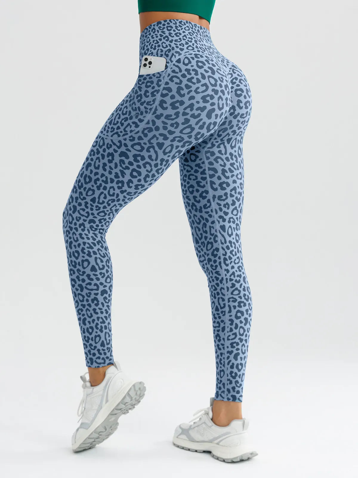 A model wearing a BRXL® B R X L™ Seamless High Waisted Butt-Lifting Leggings with Pockets