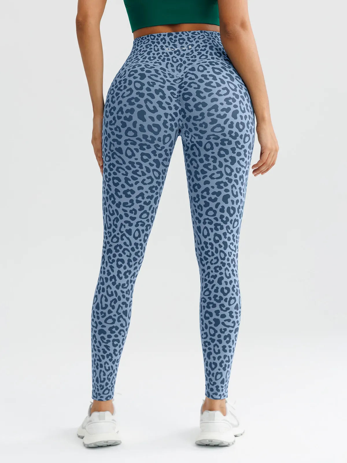 A model wearing a BRXL® B R X L™ Seamless High Waisted Butt-Lifting Leggings with Pockets
