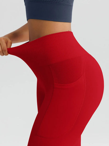 A model wearing a BRXL® B R X L™ Seamless High Waisted Butt-Lifting Leggings with Pockets