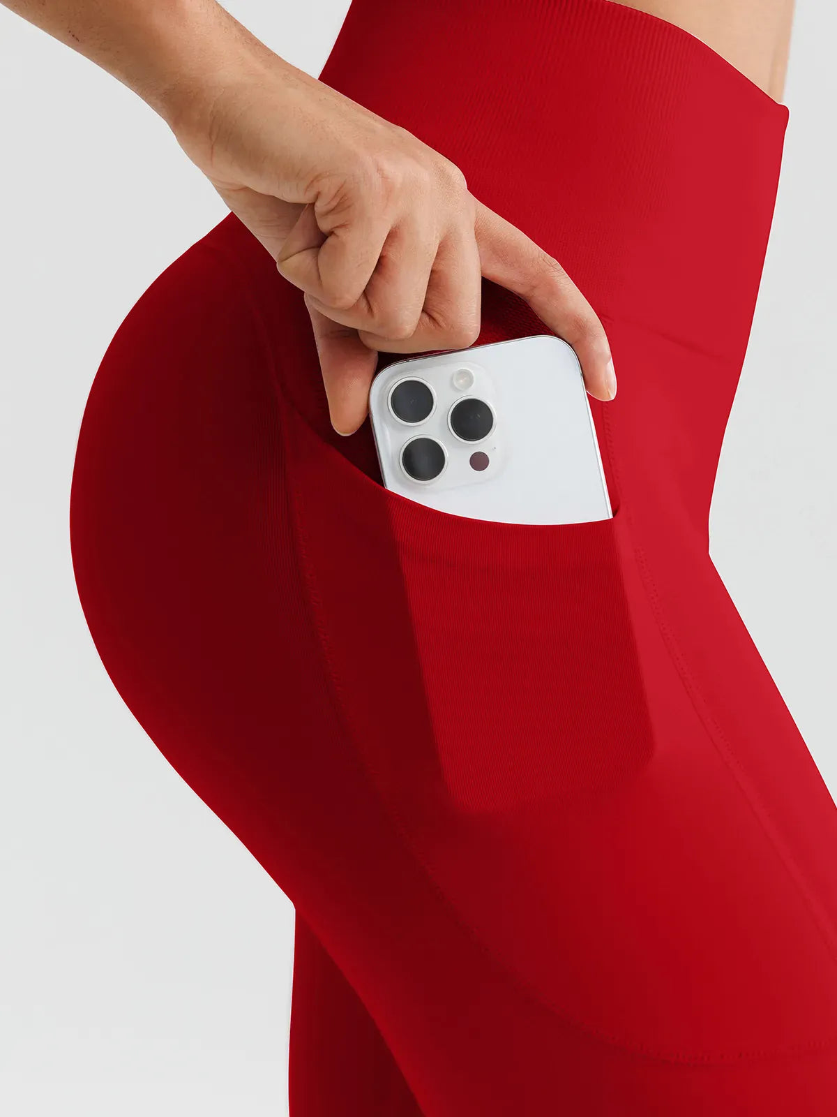 A model wearing a BRXL® B R X L™ Seamless High Waisted Butt-Lifting Leggings with Pockets