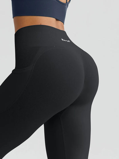 A model wearing a BRXL® B R X L™ Seamless High Waisted Butt-Lifting Leggings with Pockets
