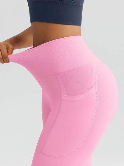 A model wearing a BRXL® B R X L™ Seamless High Waisted Butt-Lifting Leggings with Pockets