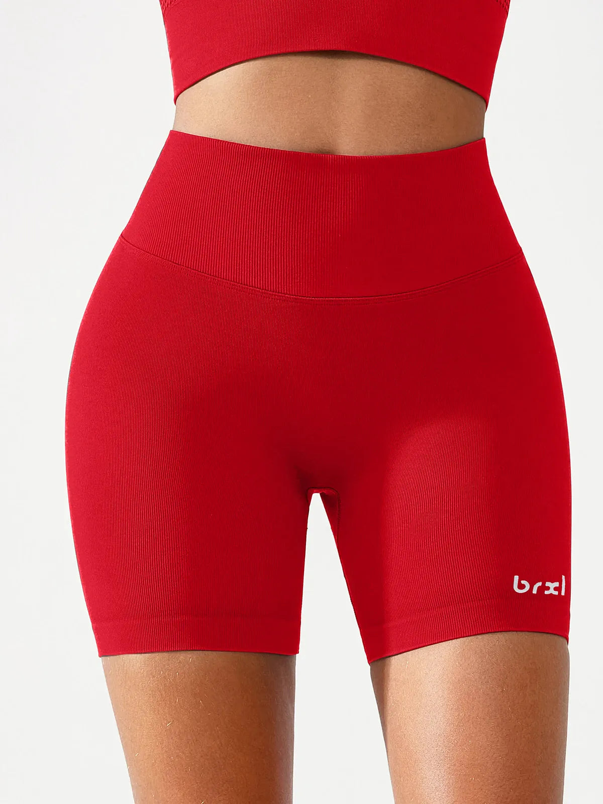 A model wearing a BRXL® B R X L™ Seamless Scrunch Butt Workout Shorts