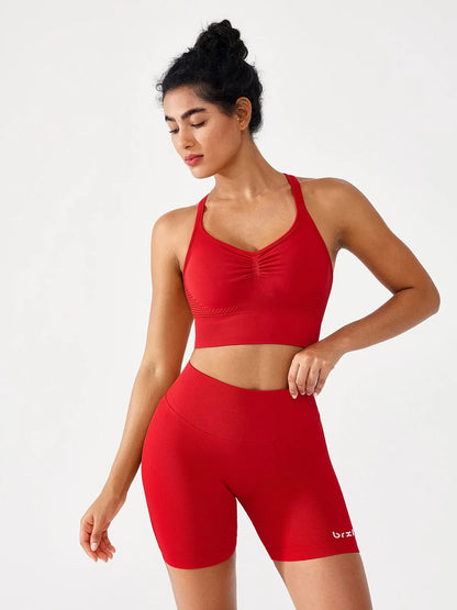 A model wearing a BRXL® B R X L™ Seamless Scrunch Butt Workout Shorts