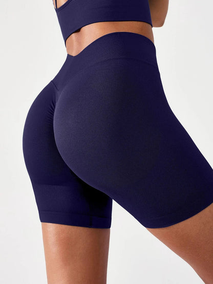 A model wearing a BRXL® BrxlGrit™ Seamless Scrunch Butt Workout Shorts Blue / S