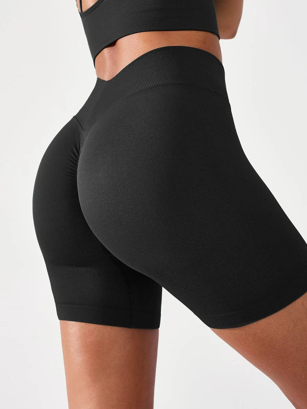 A model wearing a BRXL® BrxlGrit™ Seamless Scrunch Butt Workout Shorts Black / S