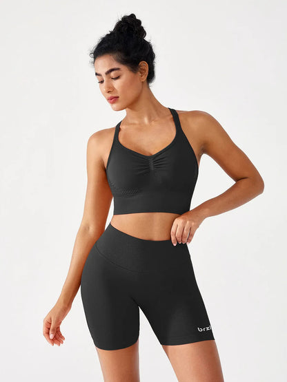 A model wearing a BRXL® B R X L™ Seamless Scrunch Butt Workout Shorts
