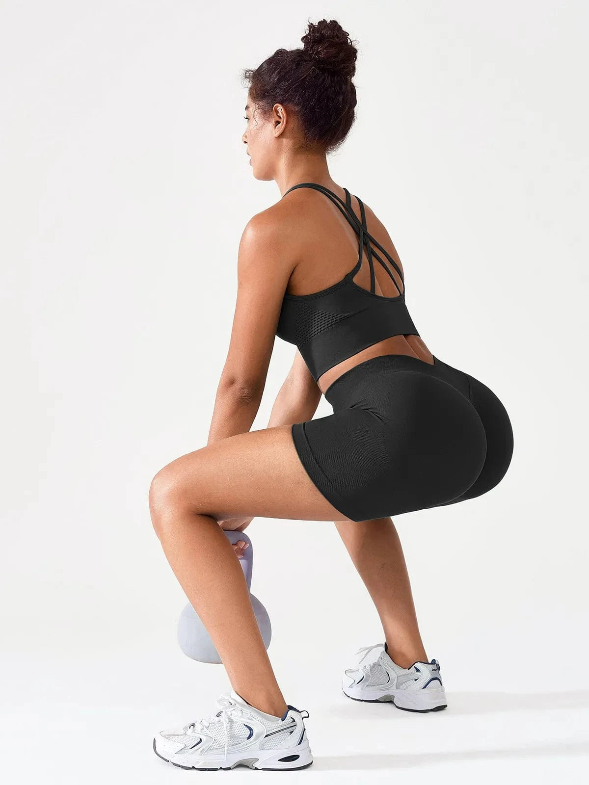 A model wearing a BRXL® BrxlGrit™ Seamless Scrunch Butt Workout Shorts