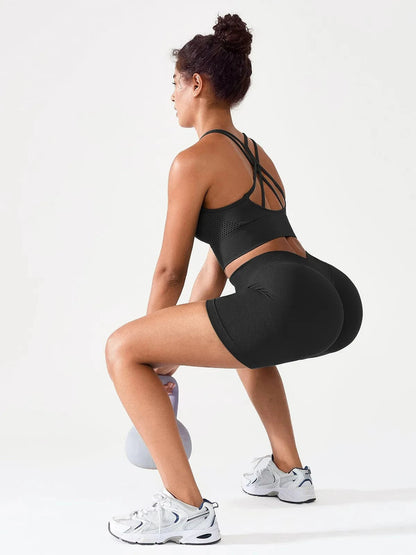 A model wearing a BRXL® BrxlGrit™ Seamless Scrunch Butt Workout Shorts