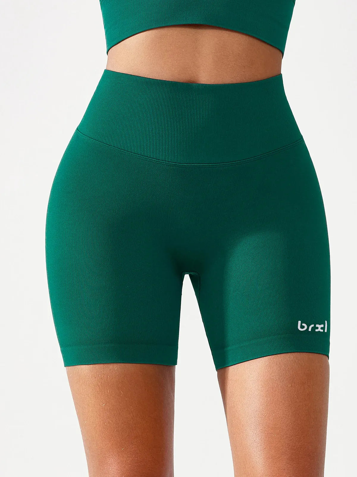 A model wearing a BRXL® B R X L™ Seamless Scrunch Butt Workout Shorts
