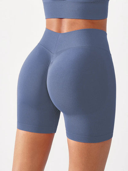 A model wearing a BRXL® B R X L™ Seamless Scrunch Butt Workout Shorts