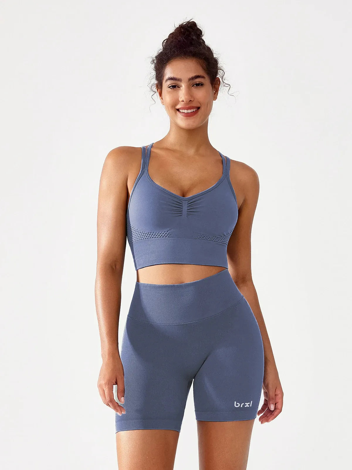 A model wearing a BRXL® B R X L™ Seamless Scrunch Butt Workout Shorts