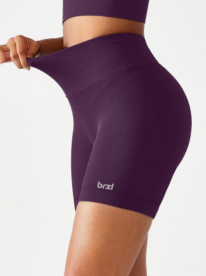 A model wearing a BRXL® B R X L™ Seamless Scrunch Butt Workout Shorts