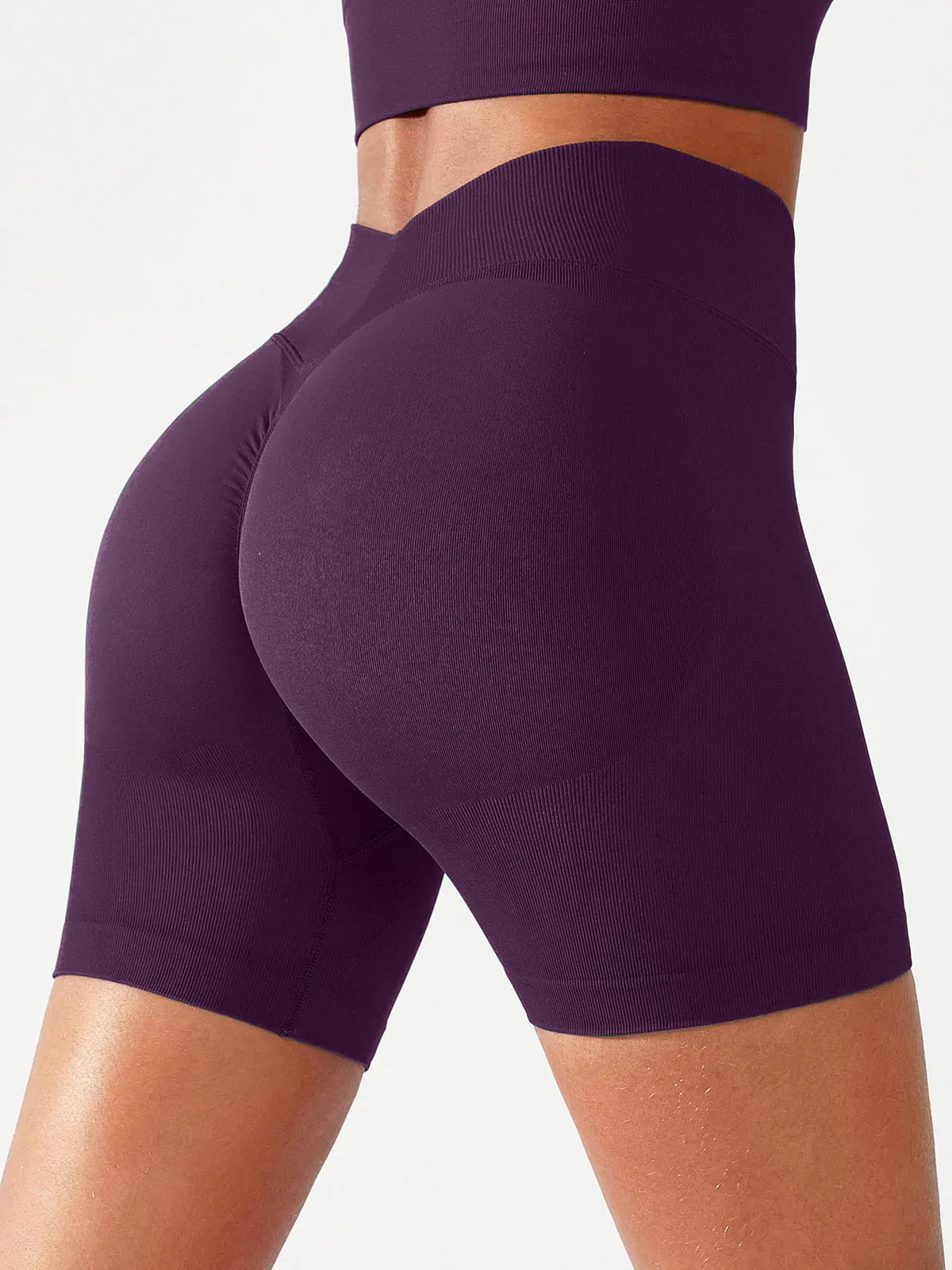 A model wearing a BRXL® B R X L™ Seamless Scrunch Butt Workout Shorts