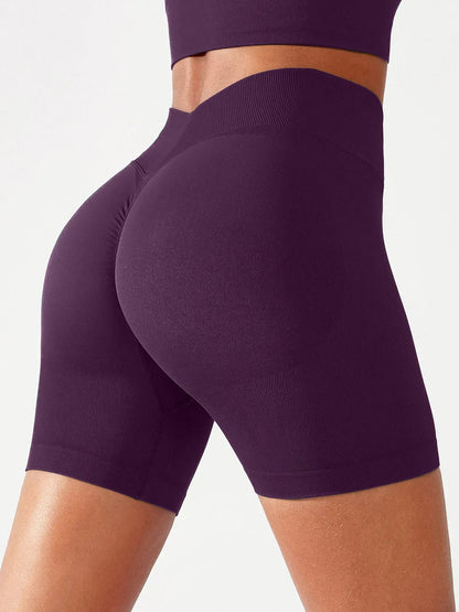 A model wearing a BRXL® B R X L™ Seamless Scrunch Butt Workout Shorts