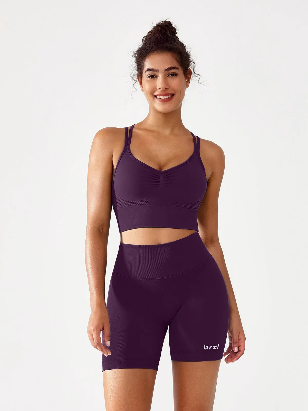 A model wearing a BRXL® B R X L™ Seamless Scrunch Butt Workout Shorts