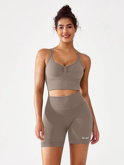 A model wearing a BRXL® B R X L™ Seamless Scrunch Butt Workout Shorts