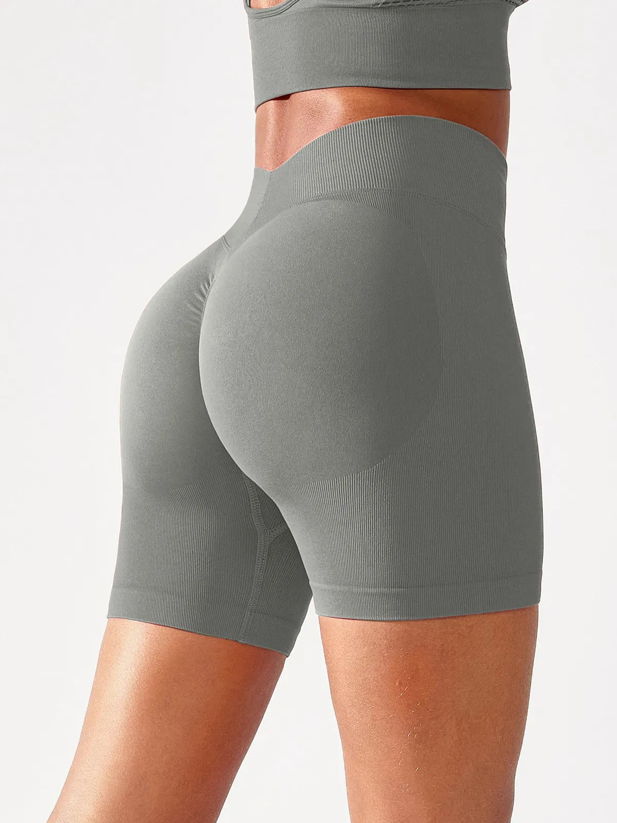 A model wearing a BRXL® B R X L™ Seamless Scrunch Butt Workout Shorts Cadet Grey / XS