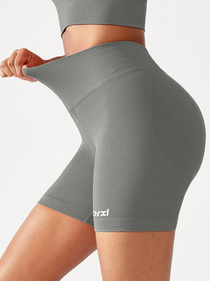 A model wearing a BRXL® B R X L™ Seamless Scrunch Butt Workout Shorts