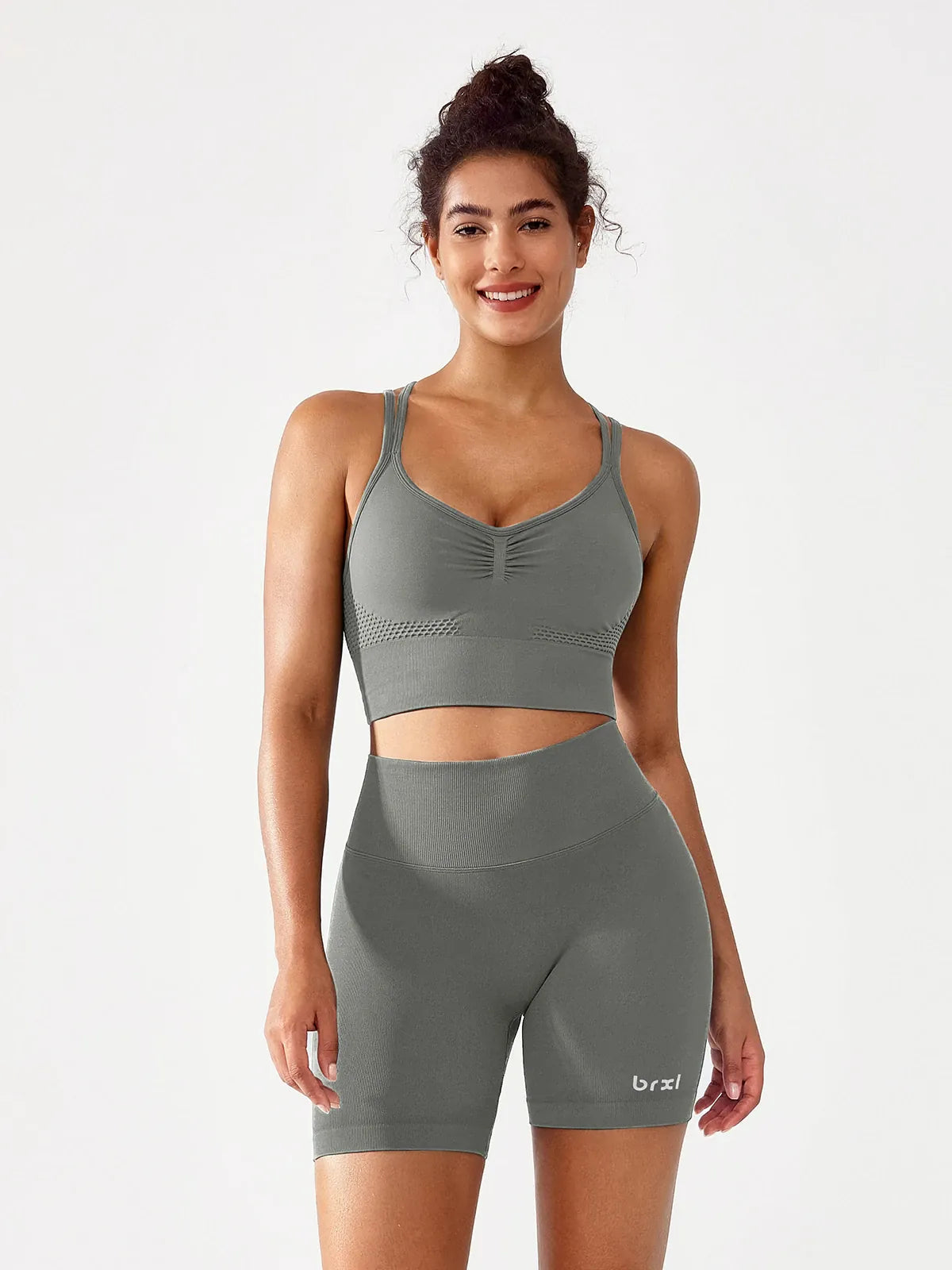 A model wearing a BRXL® B R X L™ Seamless Scrunch Butt Workout Shorts