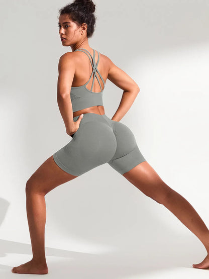 A model wearing a BRXL® B R X L™ Seamless Scrunch Butt Workout Shorts