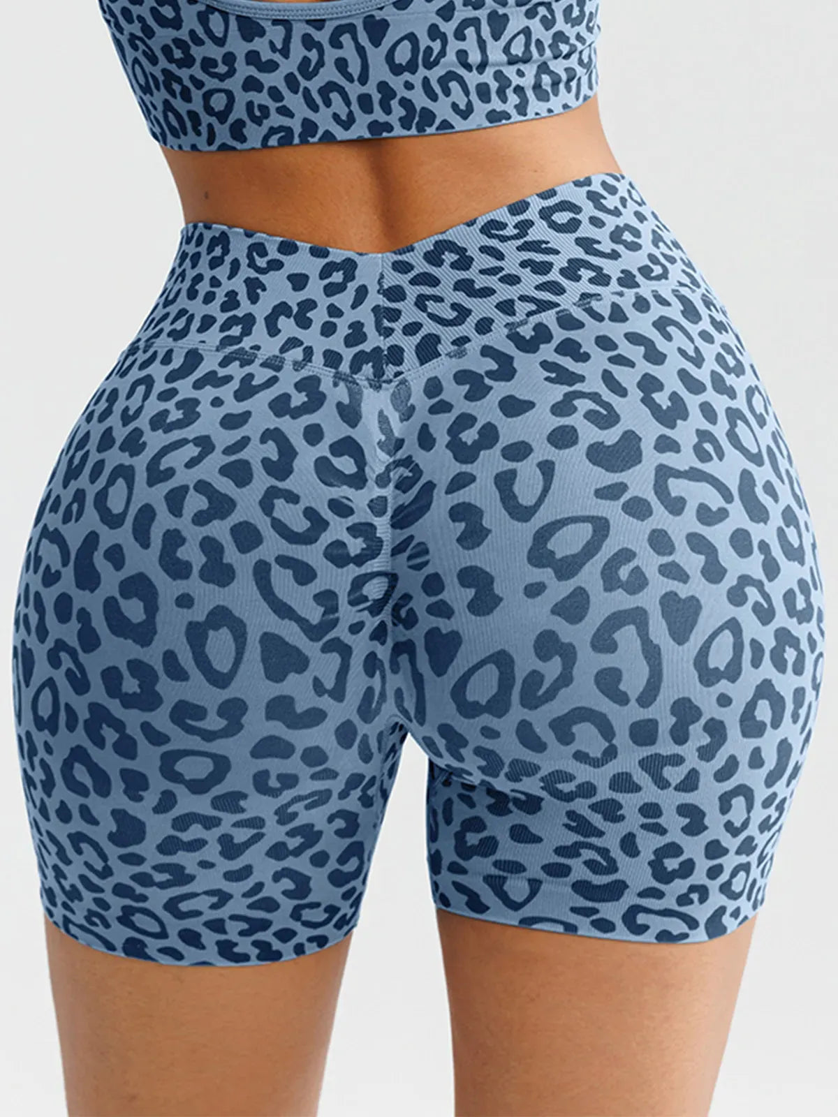 A model wearing a BRXL® B R X L™ Seamless Scrunch Butt Workout Shorts