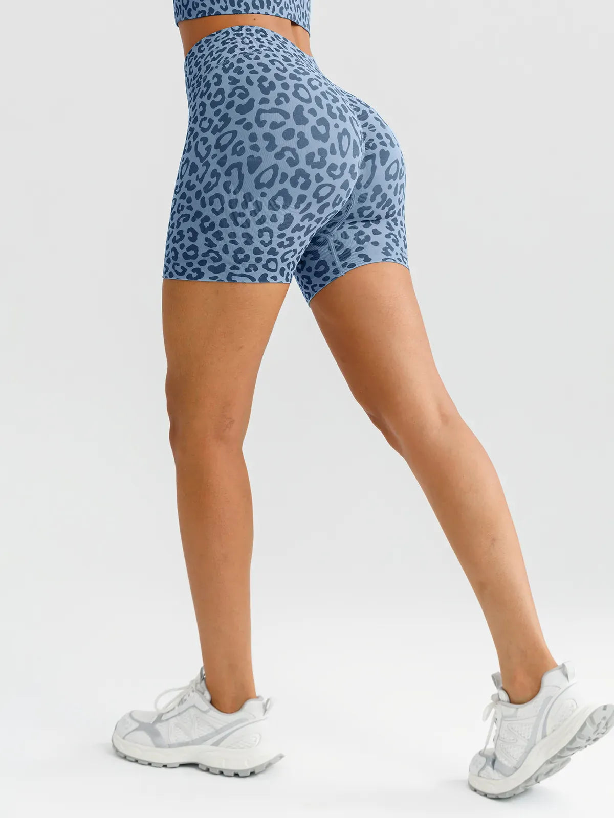 A model wearing a BRXL® B R X L™ Seamless Scrunch Butt Workout Shorts