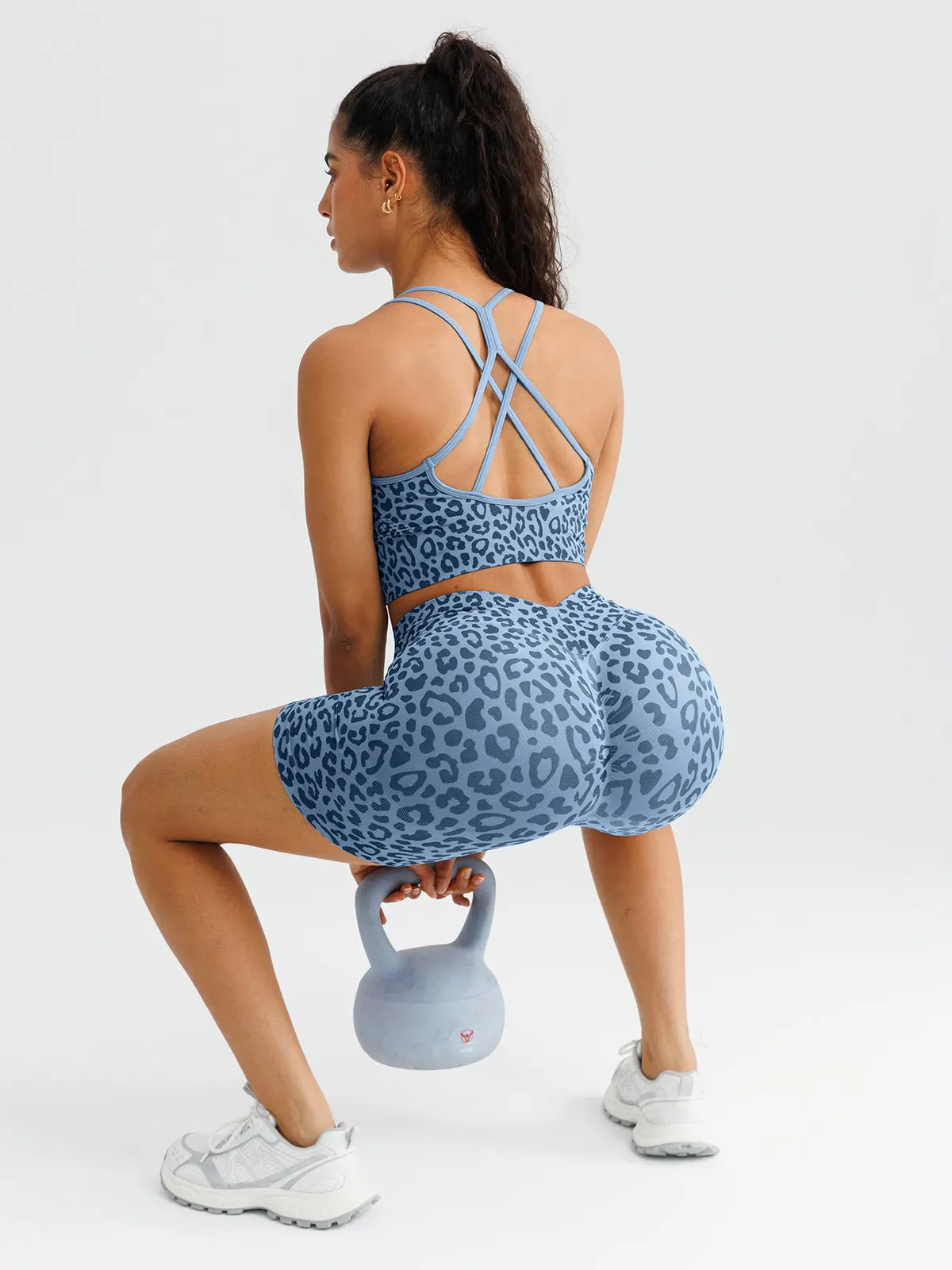A model wearing a BRXL® B R X L™ Seamless Scrunch Butt Workout Shorts