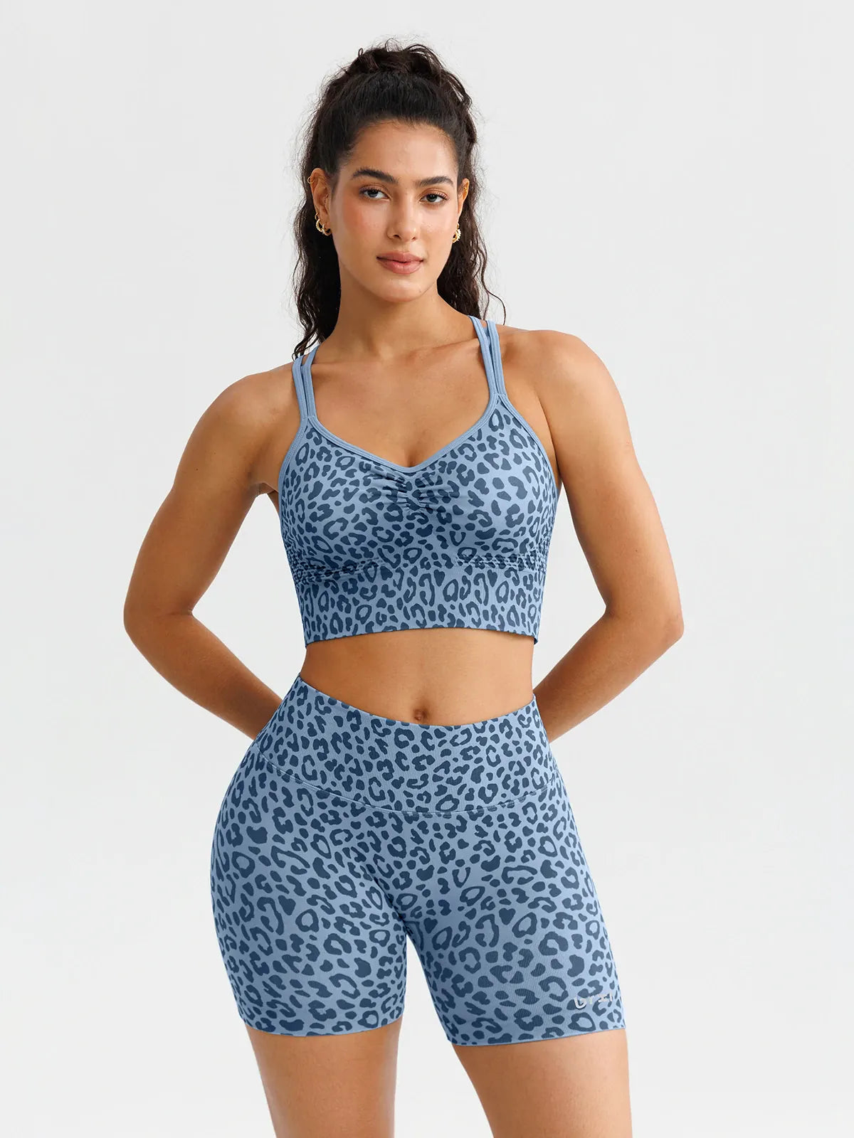 A model wearing a BRXL® B R X L™ Seamless Scrunch Butt Workout Shorts