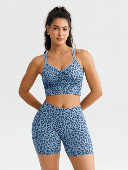A model wearing a BRXL® B R X L™ Seamless Scrunch Butt Workout Shorts