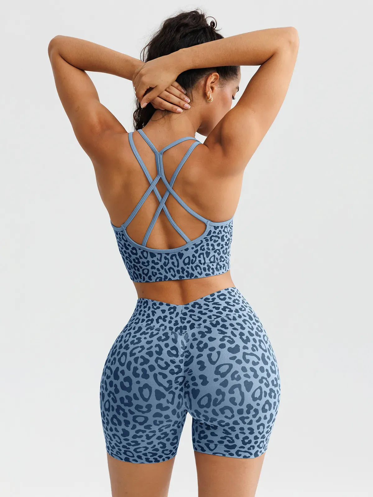 A model wearing a BRXL® B R X L™ Seamless Scrunch Butt Workout Shorts