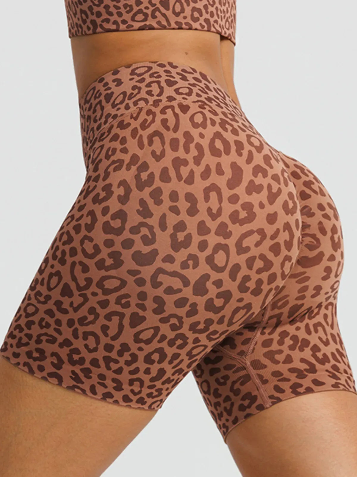 A model wearing a BRXL® B R X L™ Seamless Scrunch Butt Workout Shorts