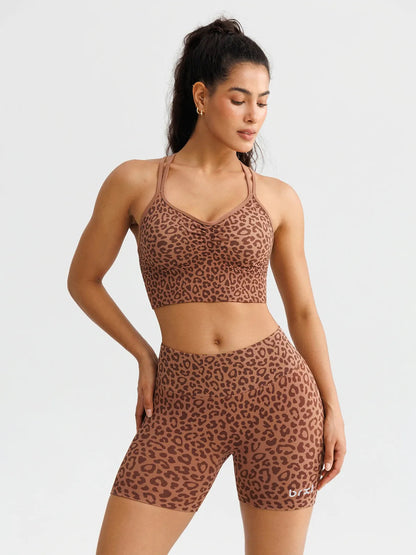 A model wearing a BRXL® B R X L™ Seamless Scrunch Butt Workout Shorts