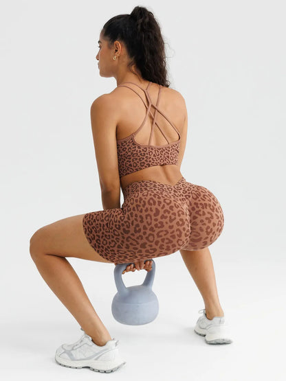 A model wearing a BRXL® B R X L™ Seamless Scrunch Butt Workout Shorts