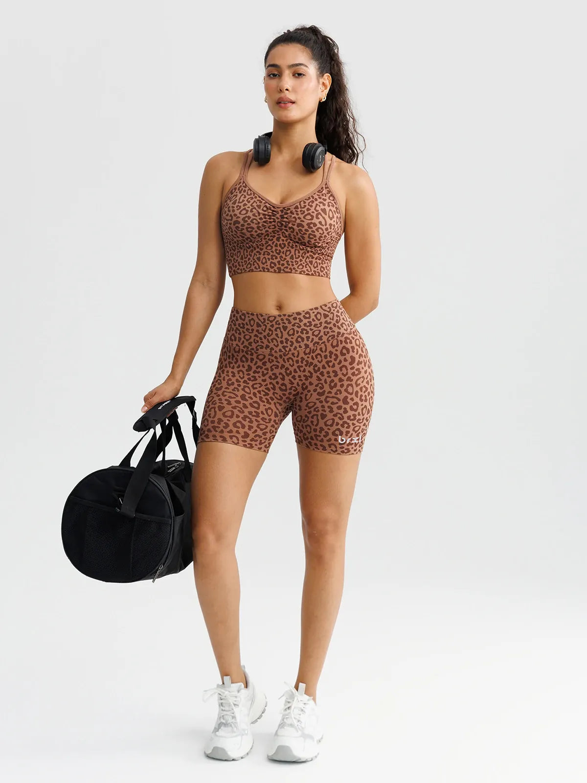A model wearing a BRXL® B R X L™ Seamless Scrunch Butt Workout Shorts