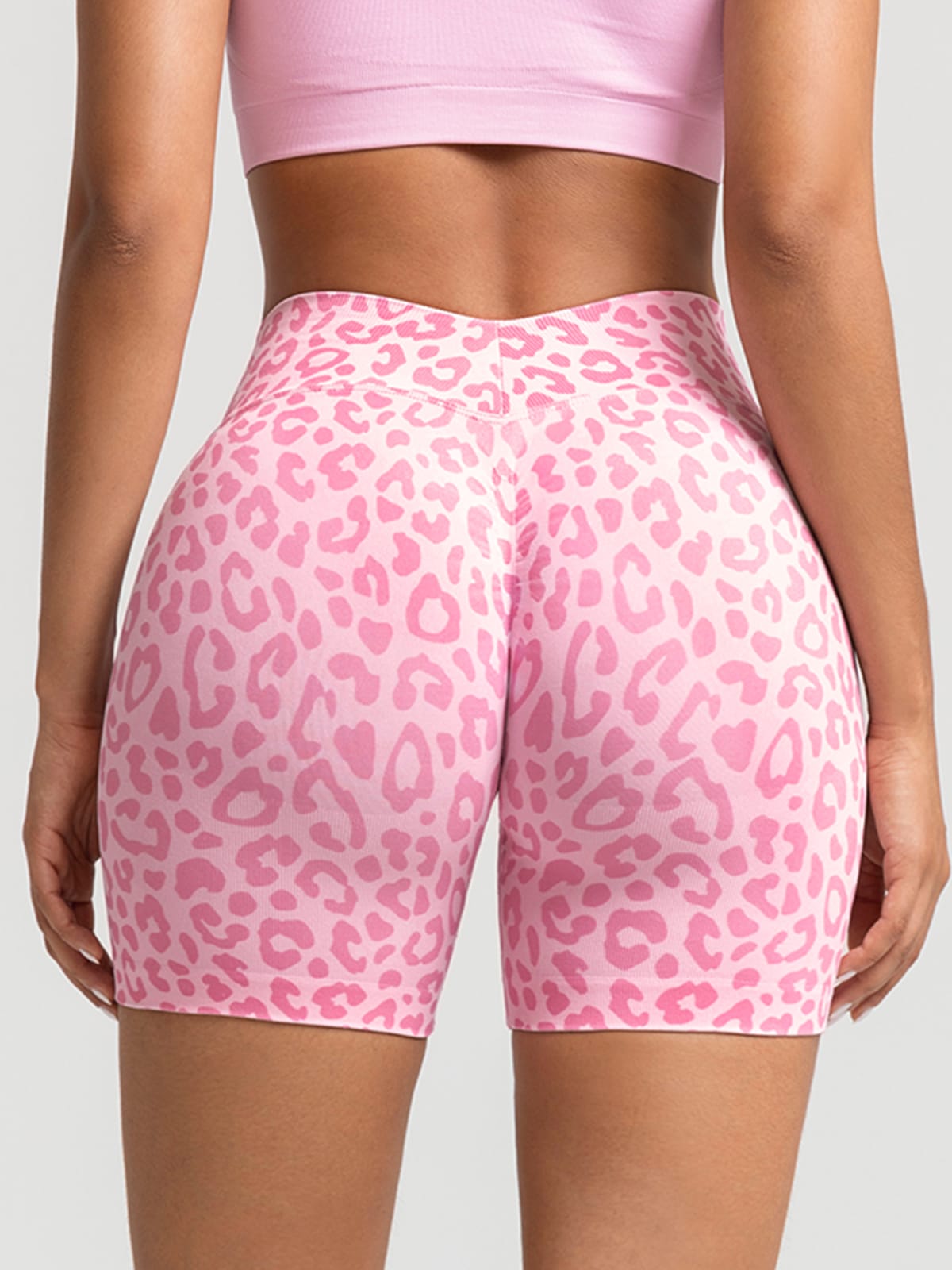 A model wearing a BRXL® B R X L™ Seamless Scrunch Butt Workout Shorts