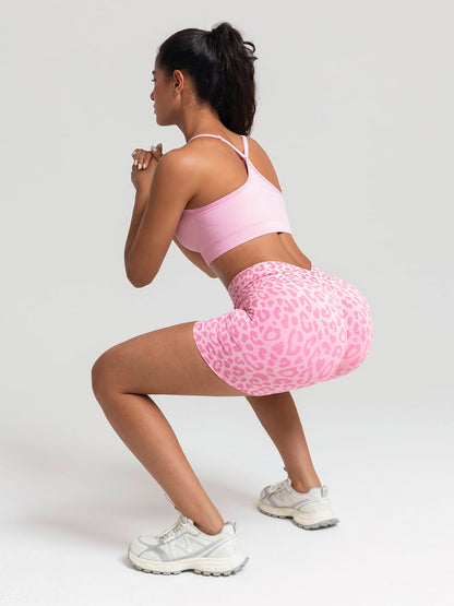 A model wearing a BRXL® B R X L™ Seamless Scrunch Butt Workout Shorts
