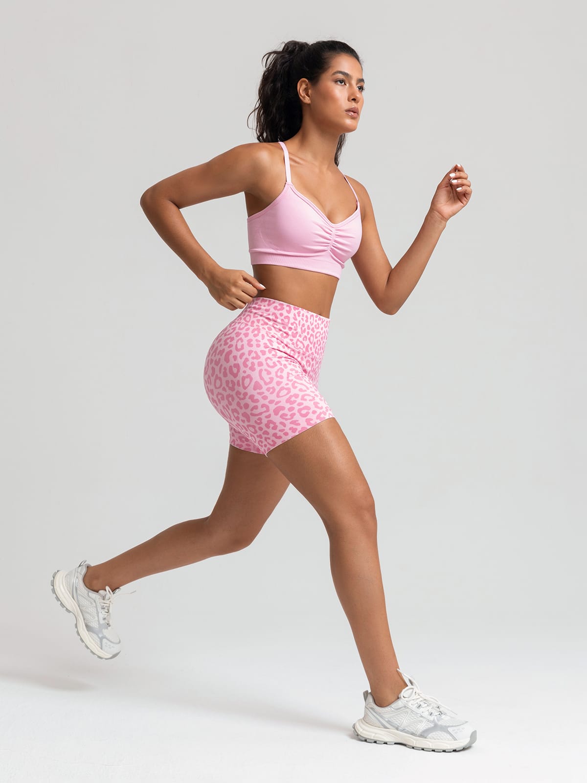 A model wearing a BRXL® B R X L™ Seamless Scrunch Butt Workout Shorts