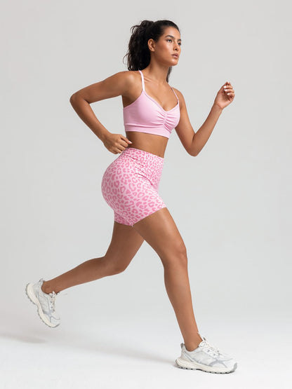 A model wearing a BRXL® B R X L™ Seamless Scrunch Butt Workout Shorts