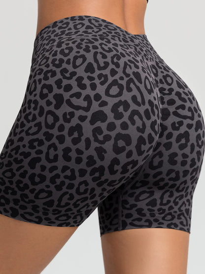 A model wearing a BRXL® B R X L™ Seamless Scrunch Butt Workout Shorts Grey Leopard / XS