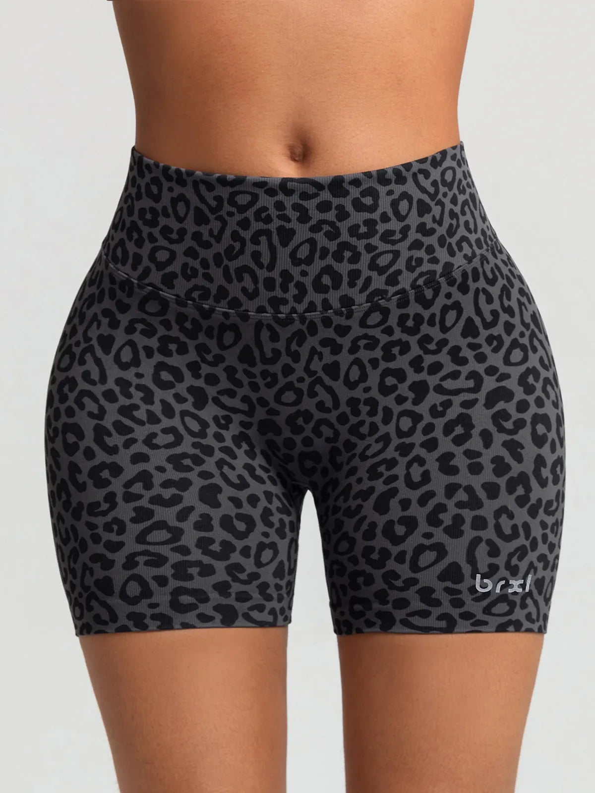 A model wearing a BRXL® B R X L™ Seamless Scrunch Butt Workout Shorts