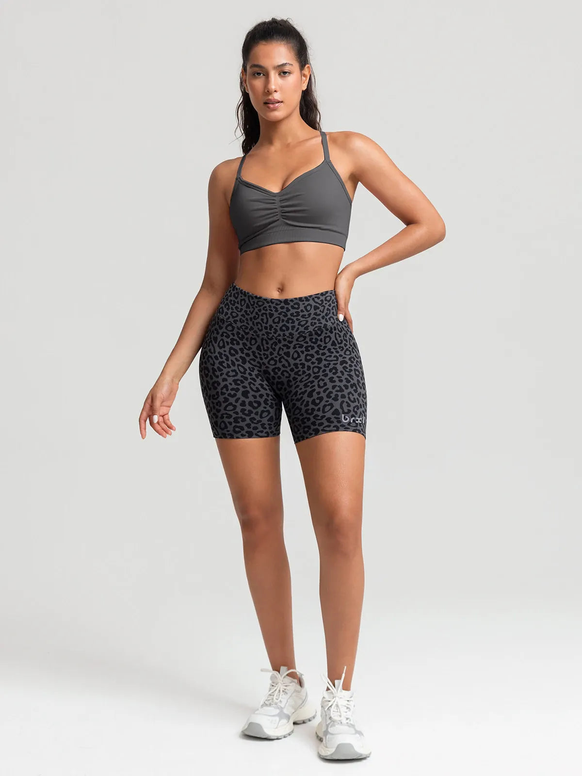 A model wearing a BRXL® B R X L™ Seamless Scrunch Butt Workout Shorts