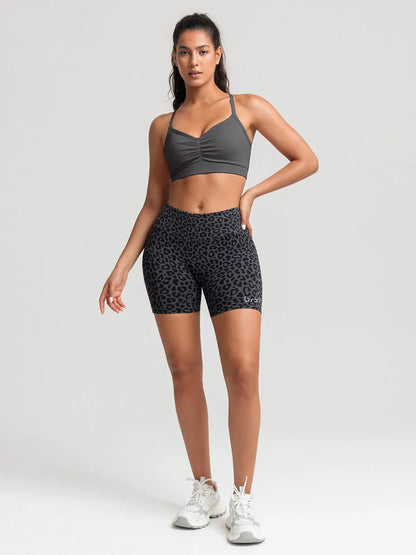 A model wearing a BRXL® B R X L™ Seamless Scrunch Butt Workout Shorts